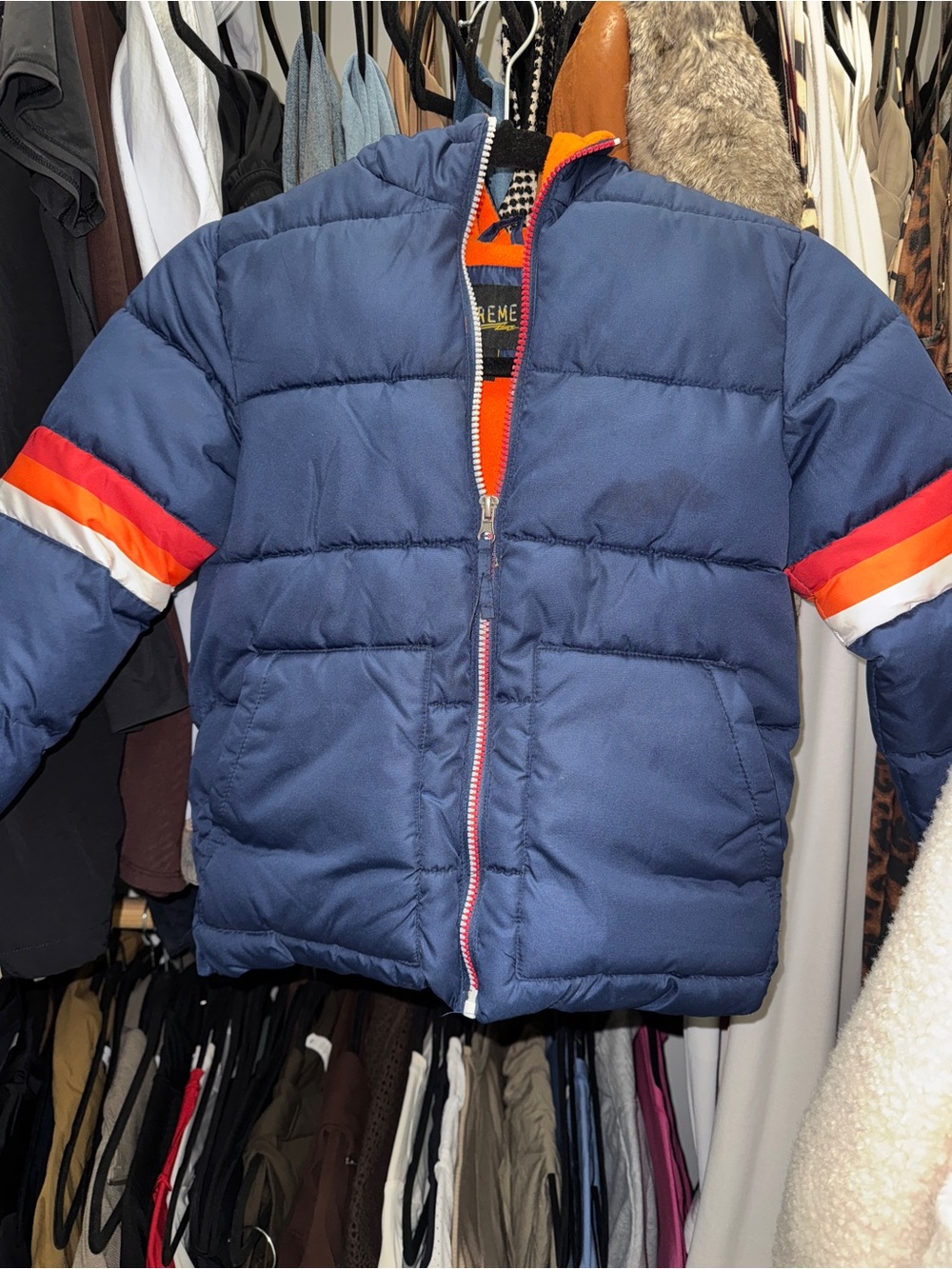 Kids Navy Puffer Jacket with Red & Orange Stripe Detail